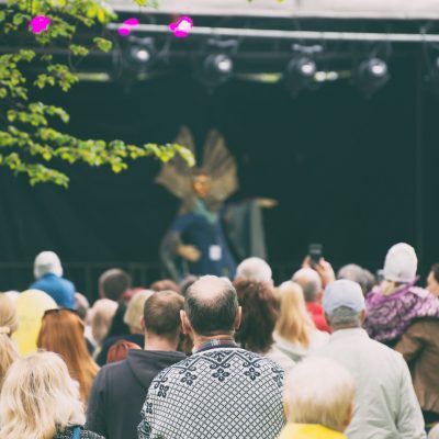 People watching live performance on stage.