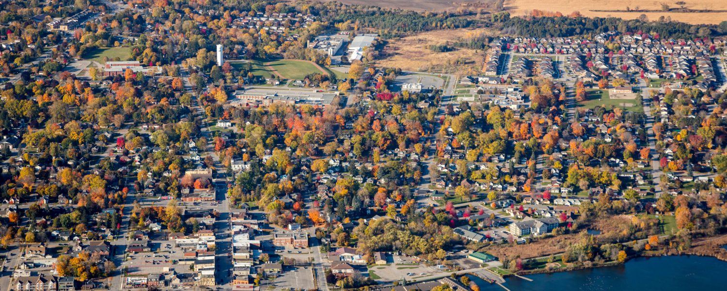 An aerial view of downtown Port Perry, a small town in Ontario, Canada. A view from the east showing waterfront on Lake Scugog.