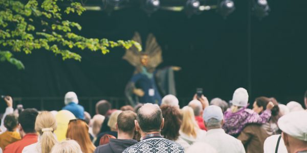 People watching live performance on stage.